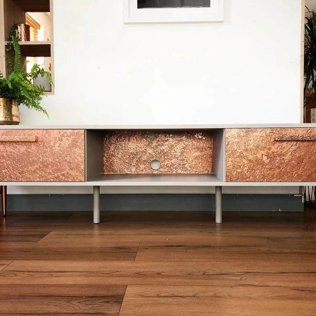 Metallic Copper stone veneer on a cabinet