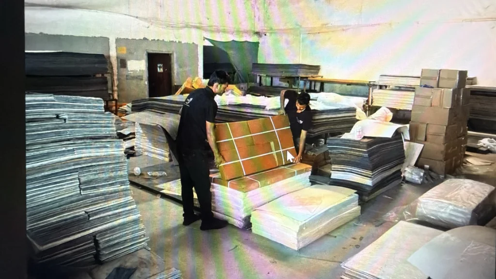 Flexible stone veneer corrugated box packaging and bundle sorting inside Ryan Stone Creations warehouse